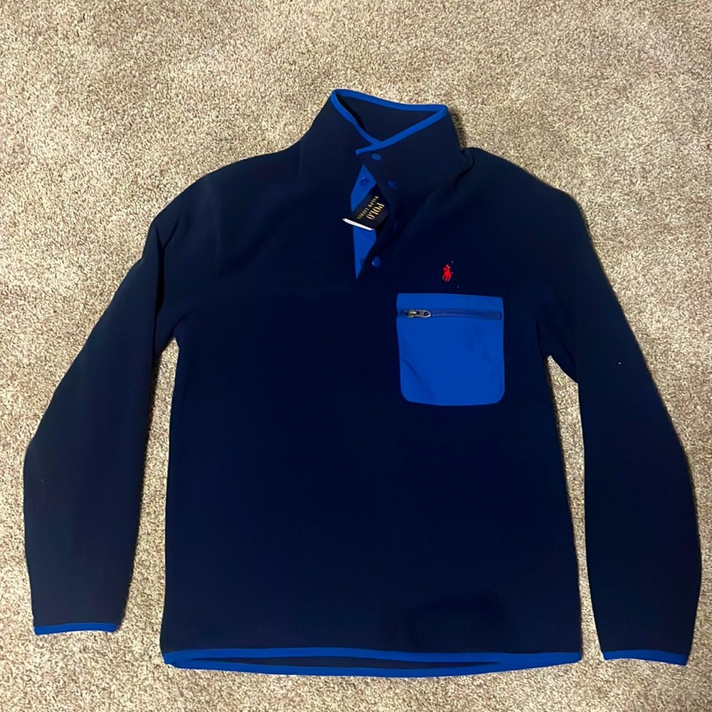 Polo pull over with zip up pocket
